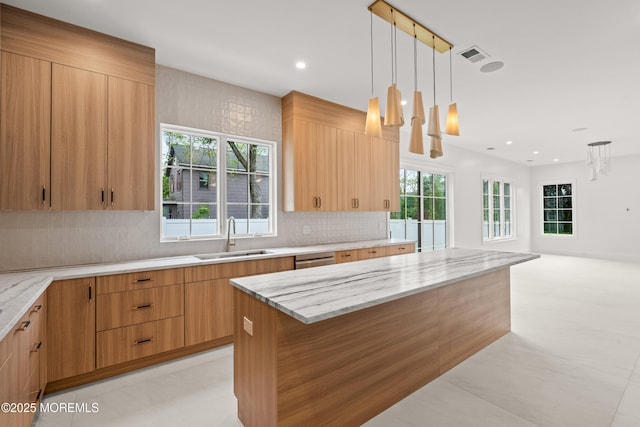 2 Deborah Pl, Oakhurst, NJ 07755 - kitchen with a sink, backsplash, light stone countertops, decorative light fixtures, and a kitchen island