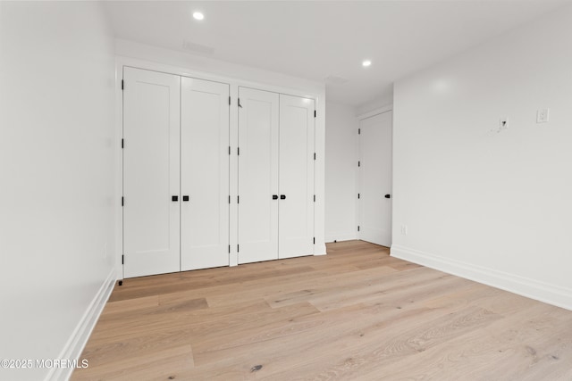 2 Deborah Pl, Oakhurst, NJ 07755 - unfurnished bedroom featuring two closets, light wood-style flooring, baseboards, and recessed lighting
