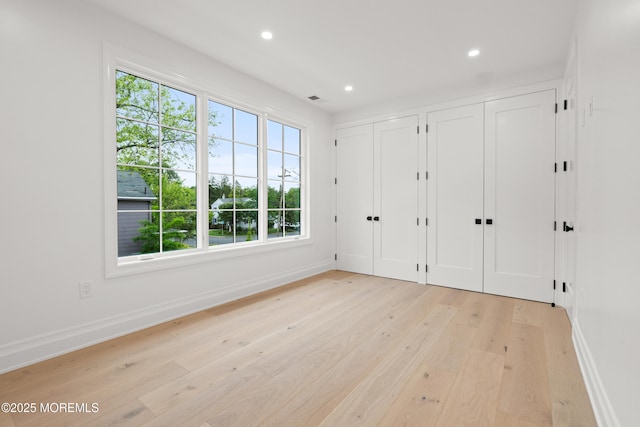 2 Deborah Pl, Oakhurst, NJ 07755 - unfurnished bedroom featuring two closets, multiple windows, baseboards, and recessed lighting
