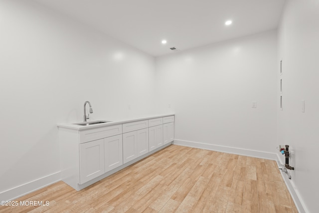 2 Deborah Pl, Oakhurst, NJ 07755 - washroom featuring a sink, light wood-type flooring, baseboards, and recessed lighting