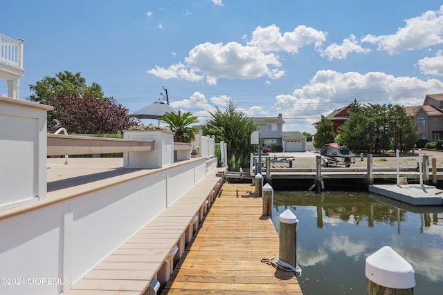 dock area with a water view