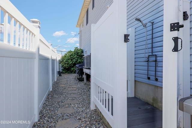 view of side of property with fence