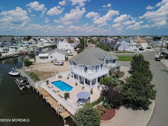 bird's eye view with a residential view and a water view