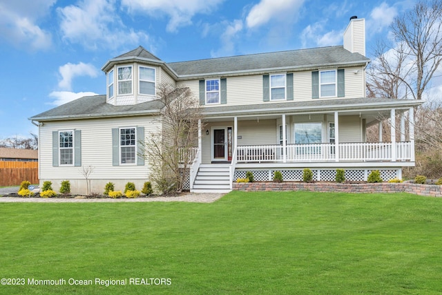 view of front of home with a front lawn and covered porch