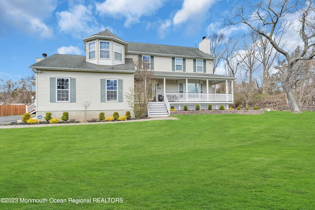 view of front of house featuring a front yard and a porch