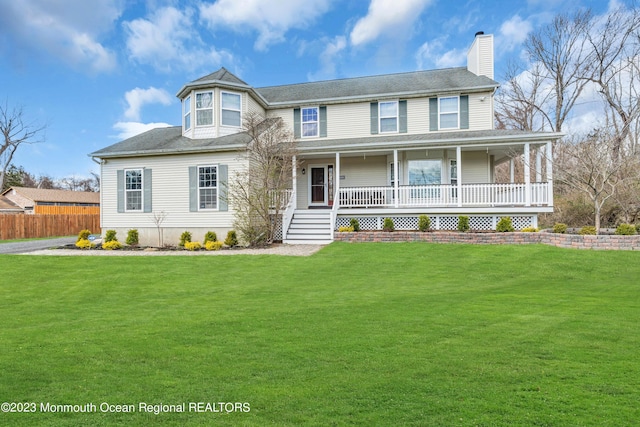 view of front of property featuring a porch and a front yard