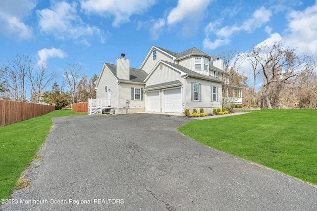 view of property exterior with a garage and a lawn