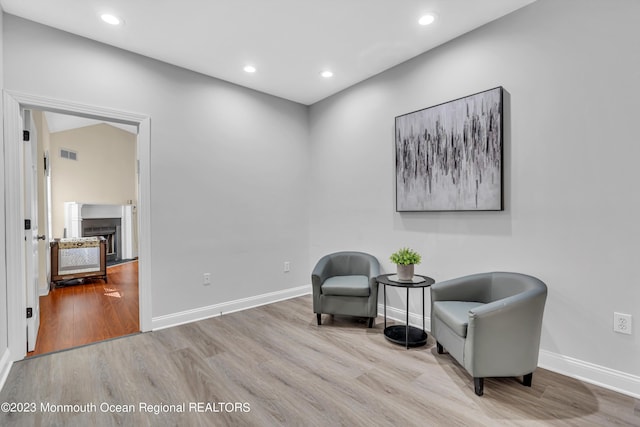 sitting room with light hardwood / wood-style flooring