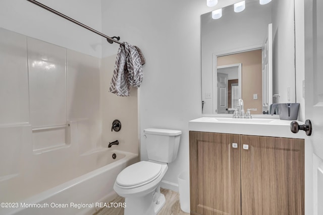 full bathroom featuring vanity,  shower combination, and toilet