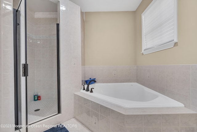 bathroom featuring tile patterned floors and plus walk in shower