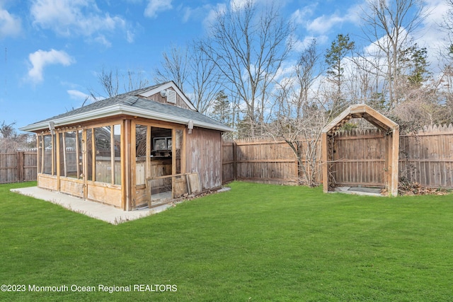 view of outbuilding featuring a lawn