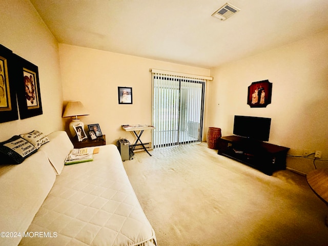 bedroom featuring carpet and access to outside