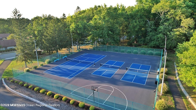 view of sport court featuring tennis court