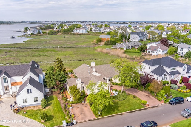 bird's eye view with a residential view and a water view