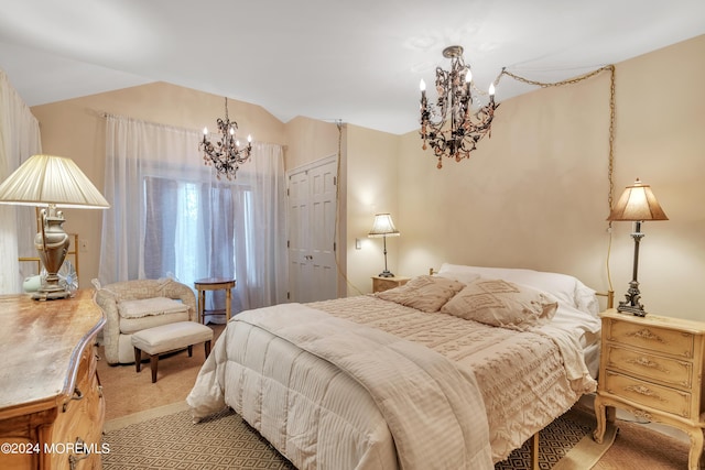 bedroom featuring lofted ceiling, a closet, light colored carpet, and a notable chandelier