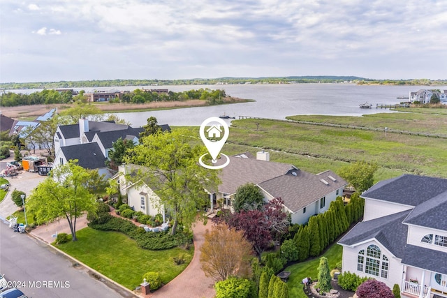 bird's eye view featuring a water view and a residential view