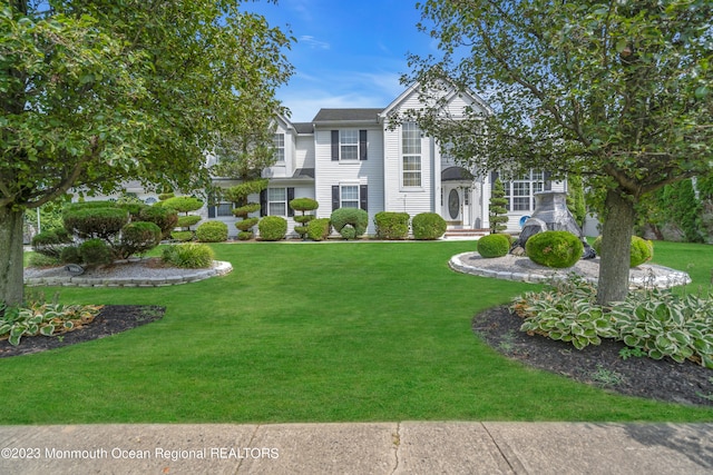 view of front of home with a front yard