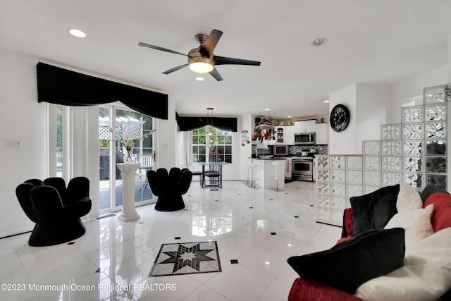 1969 Whitesville Rd, Toms River, NJ 08755 - living room featuring ceiling fan and light tile patterned floors