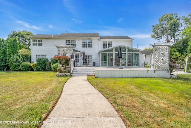 1969 Whitesville Rd, Toms River, NJ 08755 - view of front of property with a sunroom, a wooden deck, and a front yard