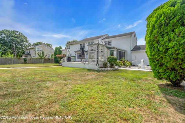 1969 Whitesville Rd, Toms River, NJ 08755 - rear view of house with a lawn and a deck