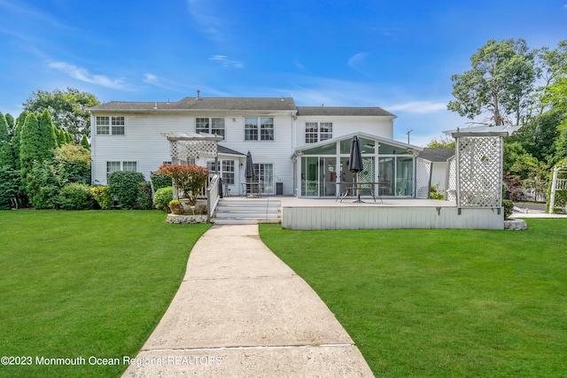 1969 Whitesville Rd, Toms River, NJ 08755 - view of front of house featuring a front lawn, a sunroom, and a deck