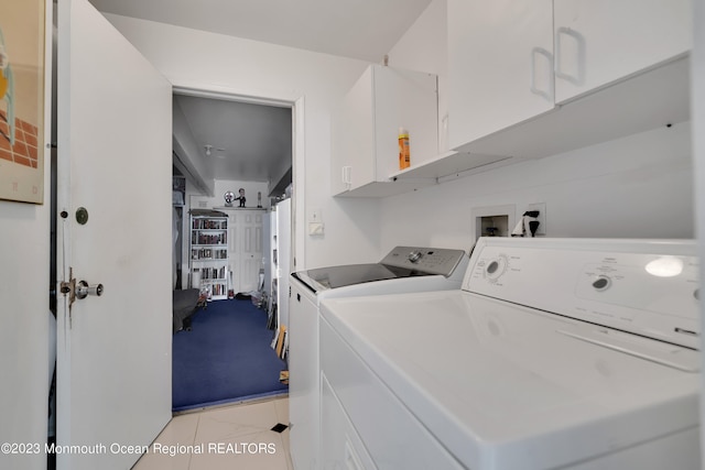 1969 Whitesville Rd, Toms River, NJ 08755 - laundry room featuring cabinets, light tile patterned flooring, and separate washer and dryer
