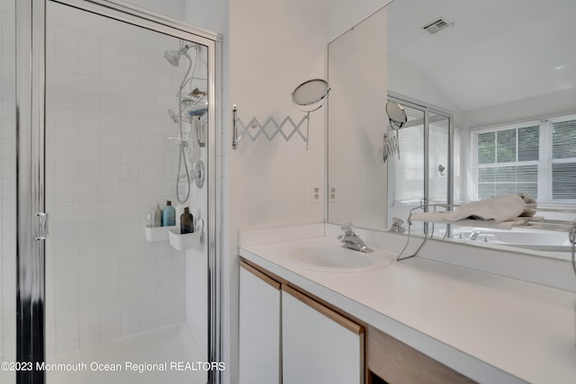 1969 Whitesville Rd, Toms River, NJ 08755 - bathroom with a shower with door, vanity, and vaulted ceiling