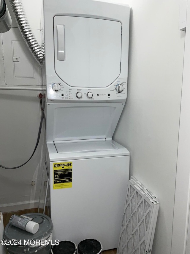 laundry room featuring stacked washer and dryer