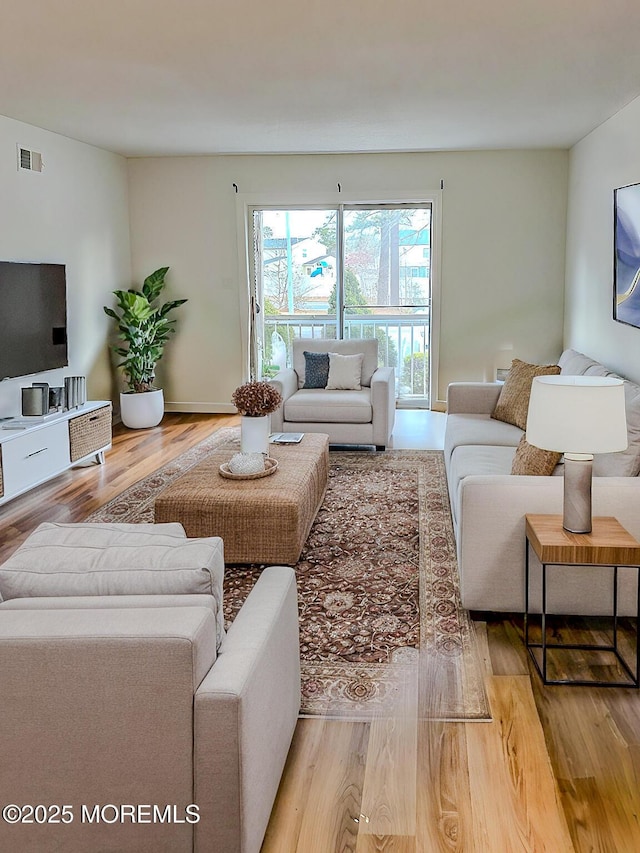 living room with light hardwood / wood-style floors