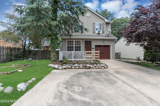 front facade with a garage and a front yard