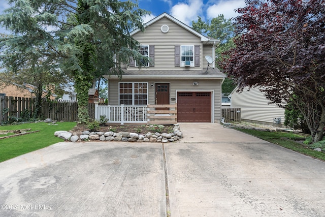 front facade with a front lawn and a garage