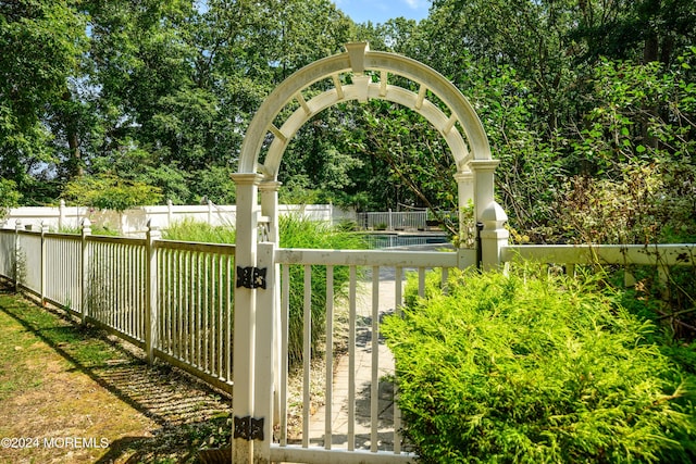 view of gate with fence