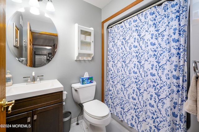 full bath featuring toilet, a shower with curtain, and vanity