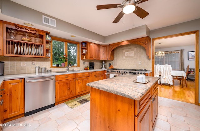 kitchen with visible vents, decorative backsplash, appliances with stainless steel finishes, a center island, and open shelves