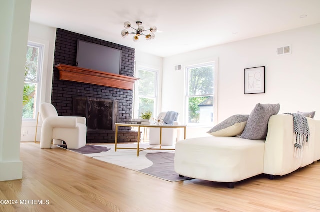 living room with plenty of natural light and light hardwood / wood-style floors