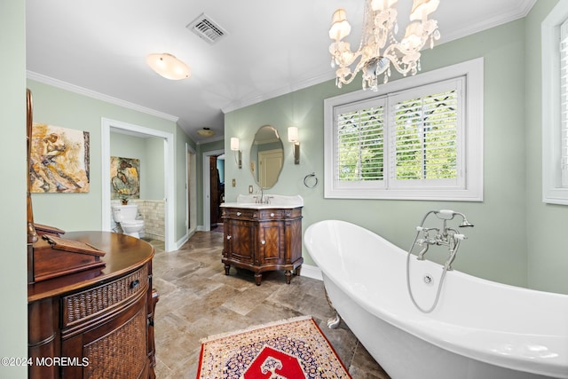 bathroom featuring an inviting chandelier, a tub to relax in, ornamental molding, tile patterned flooring, and vanity