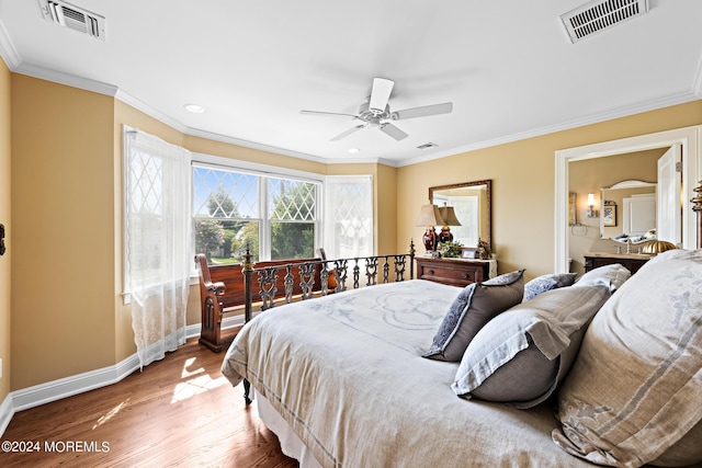 bedroom with ceiling fan, crown molding, and hardwood / wood-style flooring