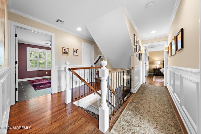 corridor featuring ornamental molding and dark hardwood / wood-style floors