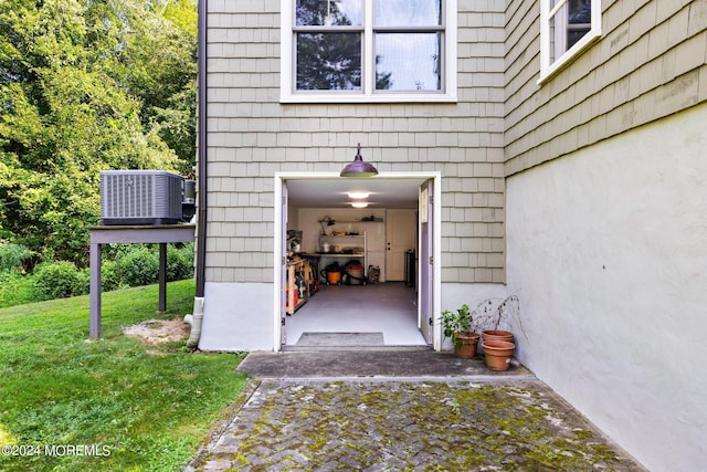 doorway to property featuring central AC unit