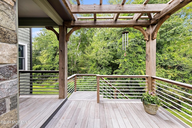 wooden terrace with a pergola