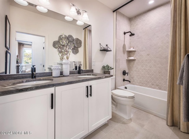 full bathroom with toilet, shower / bath combination with curtain, double sink vanity, and tile patterned floors