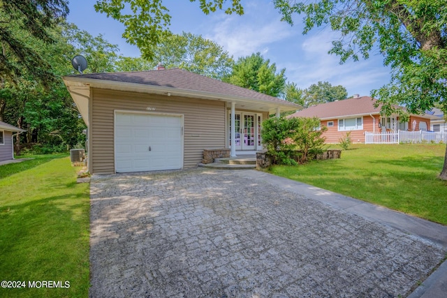 view of front facade featuring a garage, a front lawn, french doors, and cooling unit