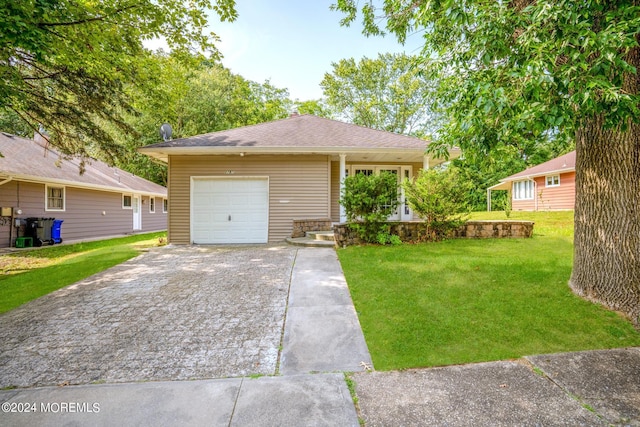 ranch-style home with a front yard and a garage