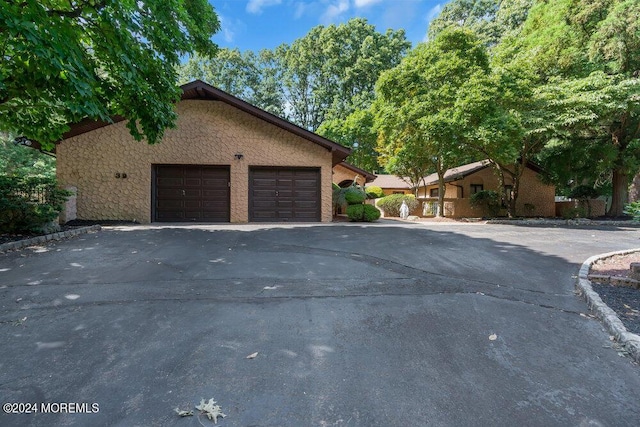 exterior space featuring a garage and driveway