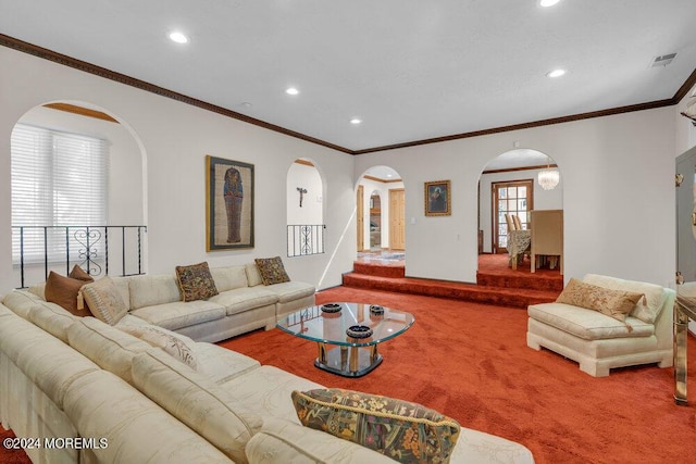 living area with arched walkways, recessed lighting, and carpet floors