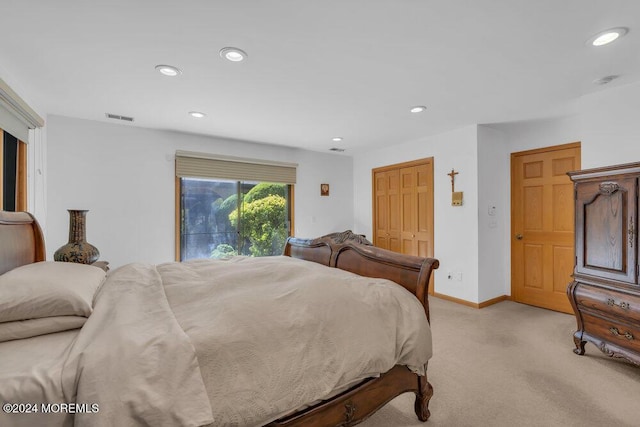 bedroom with visible vents, recessed lighting, baseboards, and light carpet