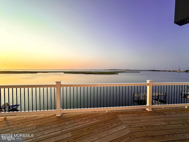 deck at dusk with a water view