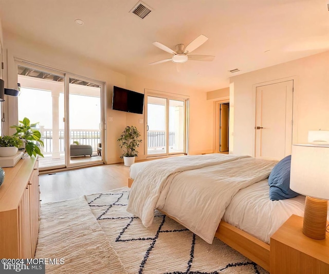 bedroom with ceiling fan, light hardwood / wood-style flooring, and access to exterior