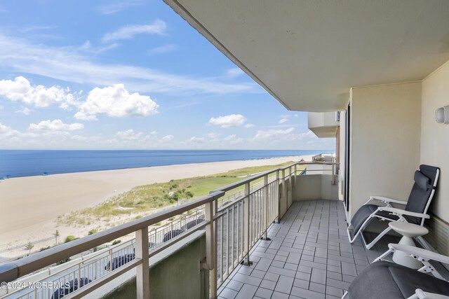 balcony with a view of the beach and a water view