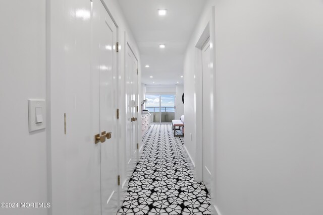 corridor featuring tile patterned flooring